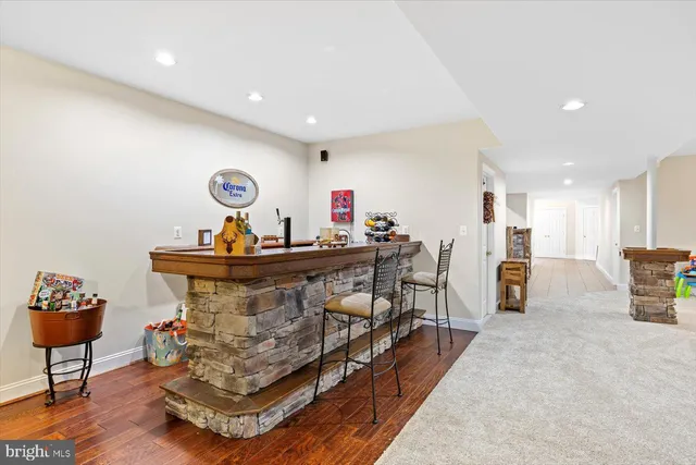 a view of a swimming pool with an outdoor space and seating area