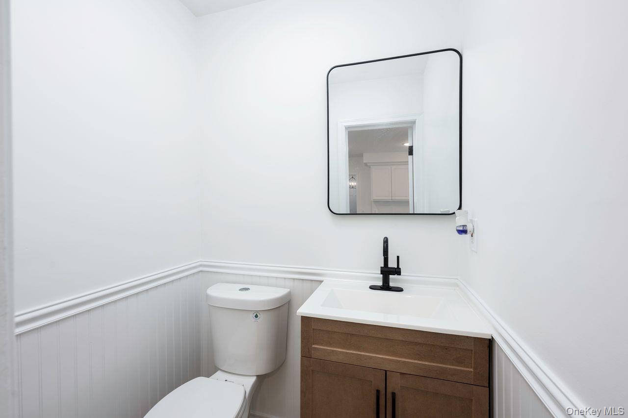2123 New Hackensack Road Poughkeepsie, NY 12603 - Photo 13 of 30 a bathroom with a toilet a sink and mirror
