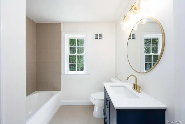 a bathroom with a sink toilet and a bathtub