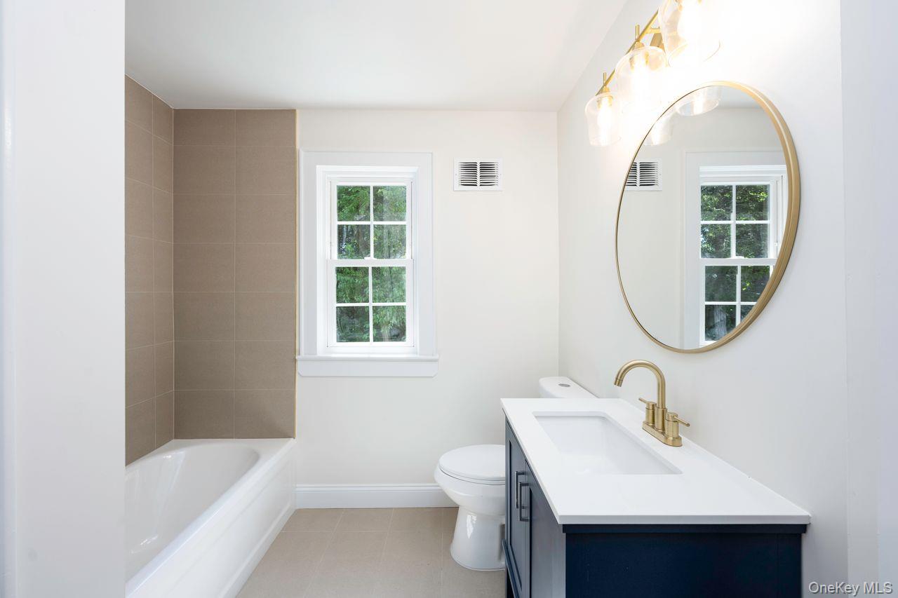 2123 New Hackensack Road Poughkeepsie, NY 12603 - Photo 19 of 30 a bathroom with a sink toilet and a bathtub
