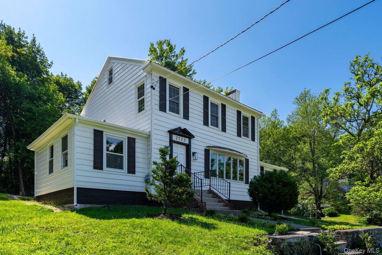 2123 New Hackensack Road Poughkeepsie, NY 12603 - Photo 22 of 30 a front view of a house with a garden