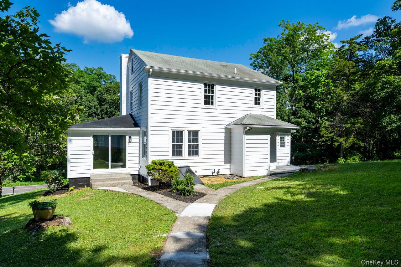 2123 New Hackensack Road Poughkeepsie, NY 12603 - Photo 23 of 30 a front view of a house with a garden and yard