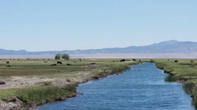 a view of a lake with mountains in the background