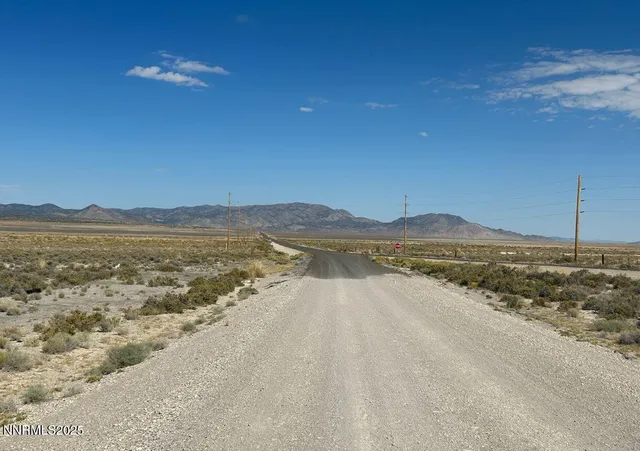 a view of an ocean beach and mountain