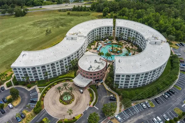 an outdoor sitting area with furniture and garden