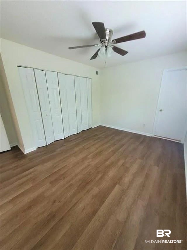 6701 Dickens Ferry Road, Unit 53 Mobile, AL 36608 - Photo 16 of 23 Unfurnished bedroom with wood finished floors, a closet, and ceiling fan