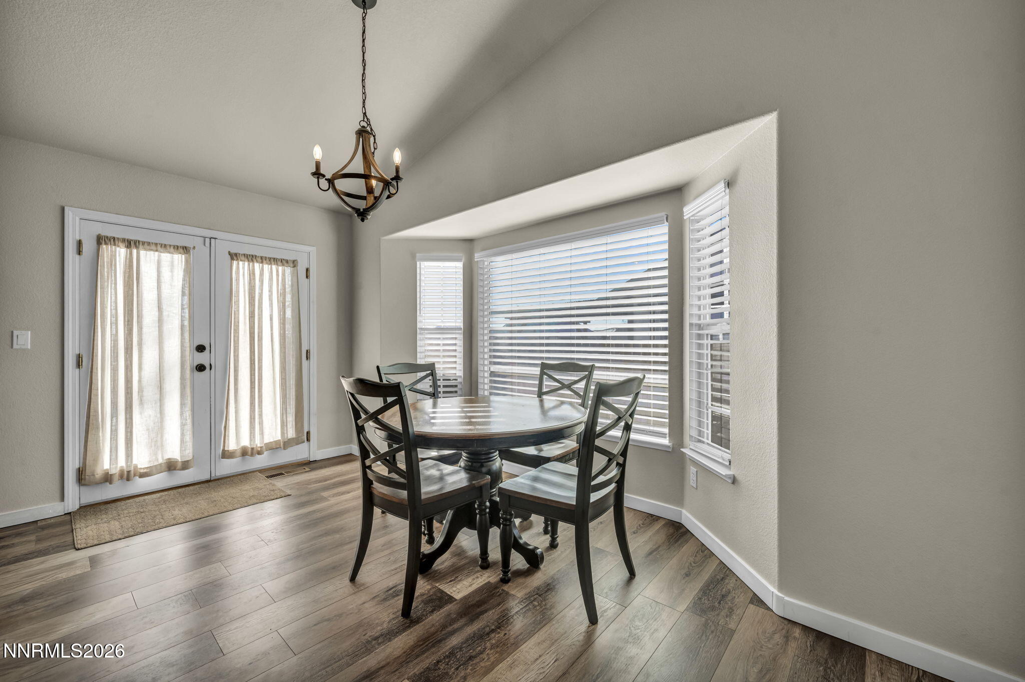 952 Red Falcon Way Spanish Springs, NV 89441 - Photo 13 of 46 a view of a dining room with furniture window and wooden floor