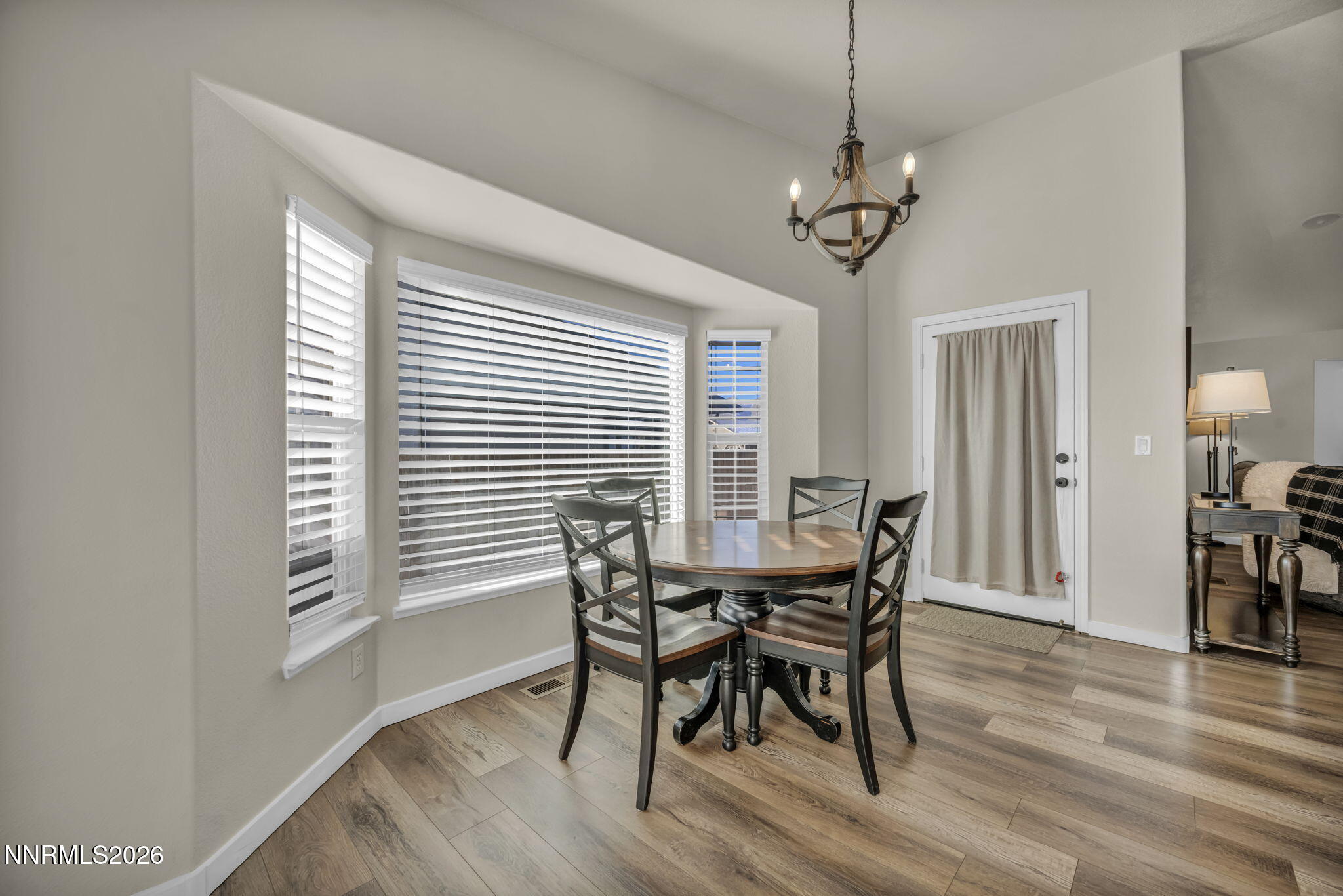 952 Red Falcon Way Spanish Springs, NV 89441 - Photo 14 of 46 a view of a dining room with furniture window and wooden floor
