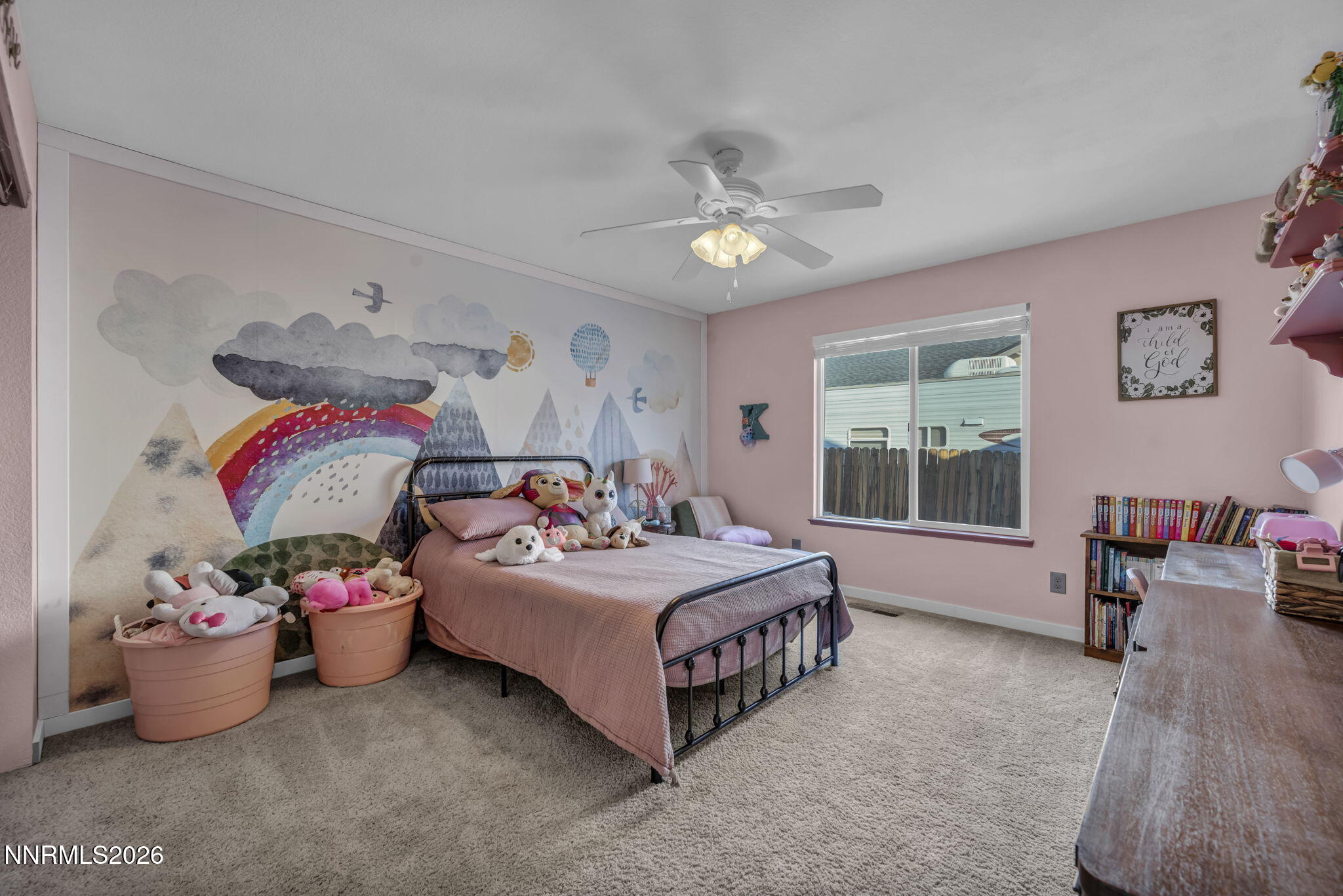 952 Red Falcon Way Spanish Springs, NV 89441 - Photo 23 of 46 a bedroom with bed and a chandelier