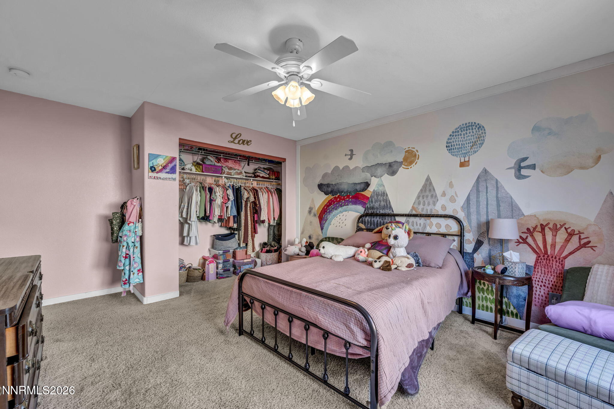 952 Red Falcon Way Spanish Springs, NV 89441 - Photo 24 of 46 a bedroom with a bed and a chandelier