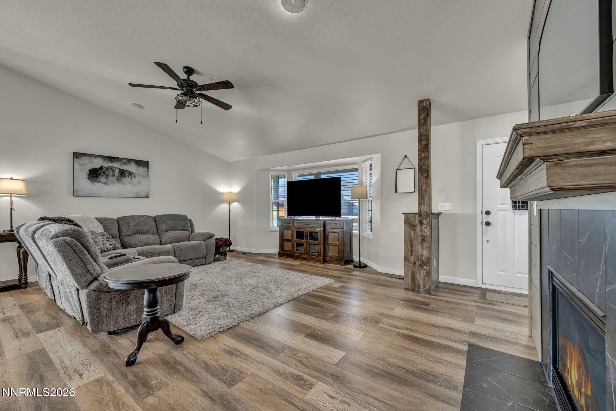 952 Red Falcon Way Spanish Springs, NV 89441 - Photo 5 of 46 a living room with furniture and a flat screen tv