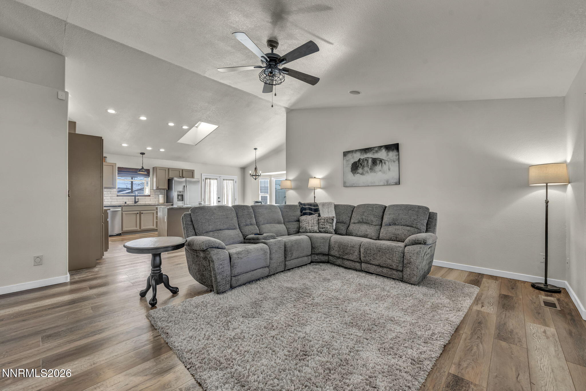 952 Red Falcon Way Spanish Springs, NV 89441 - Photo 6 of 46 a living room with furniture and a wooden floor