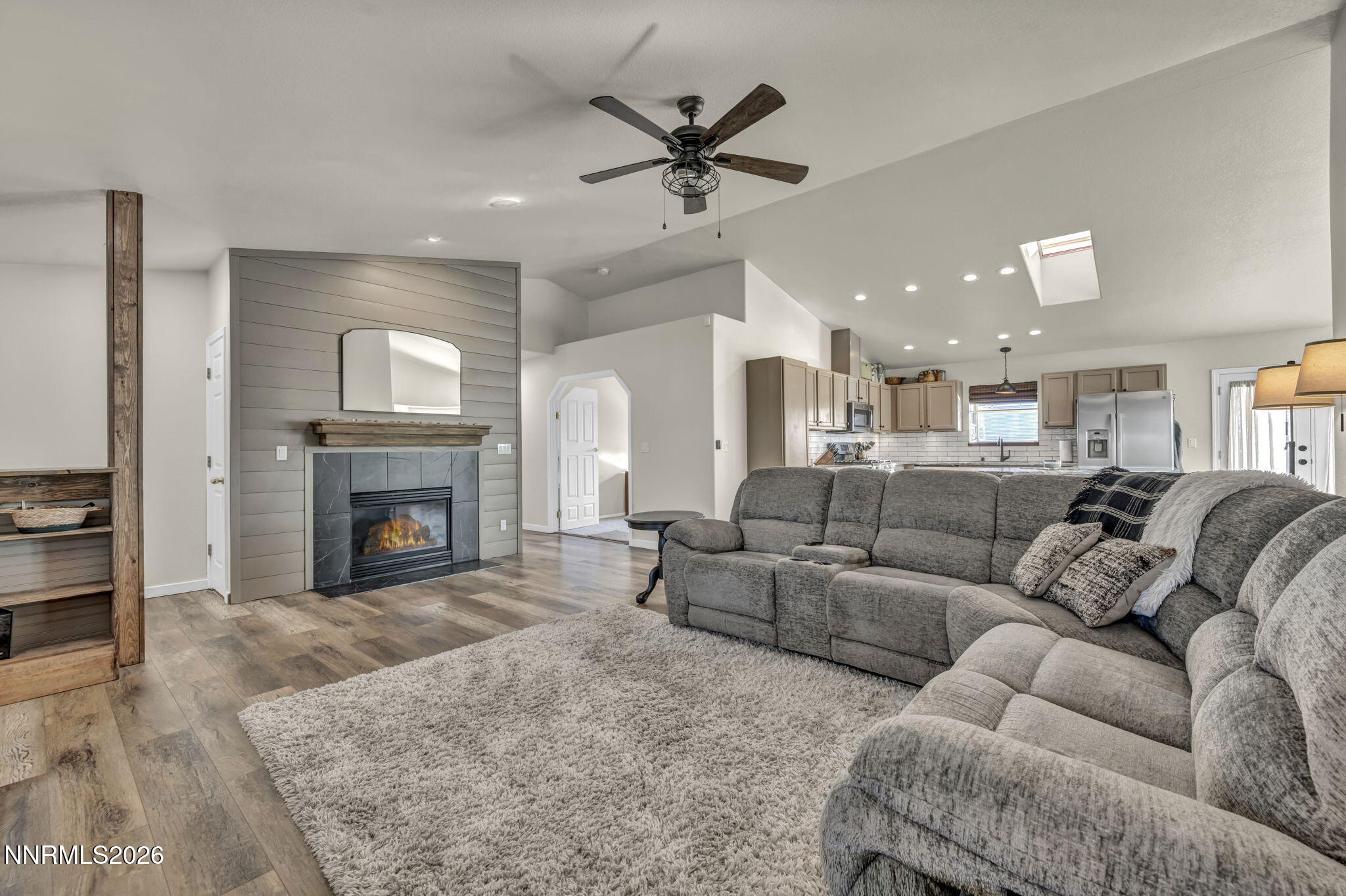 952 Red Falcon Way Spanish Springs, NV 89441 - Photo 7 of 46 a living room with furniture and a fireplace