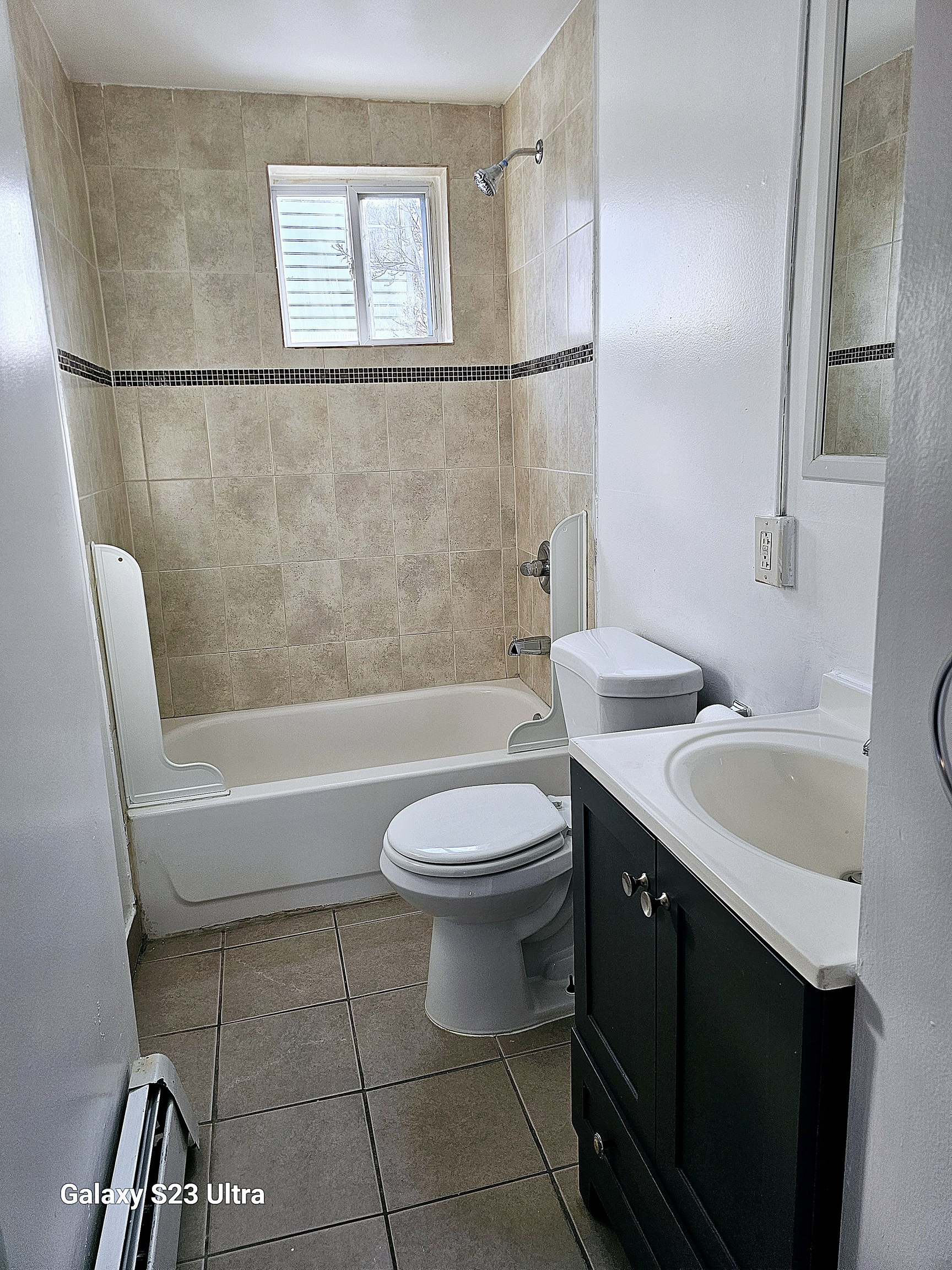 124 Division Street Waterbury, CT 06704 - Photo 4 of 12 a bathroom with a sink a toilet and bathtub