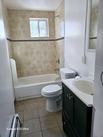 a bathroom with a sink a toilet and bathtub