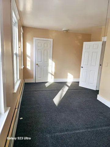 a view of empty room with front door
