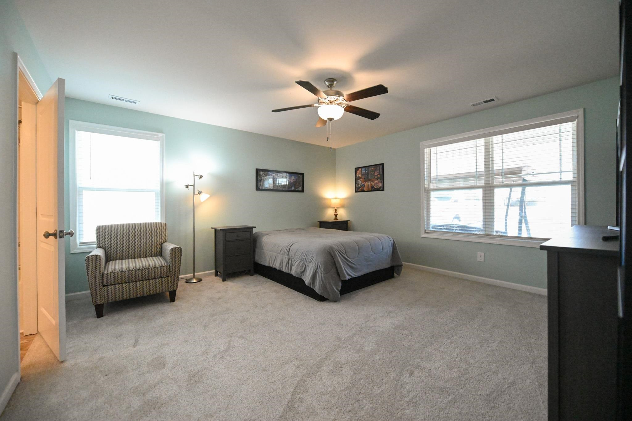 132 Winter Red Way Benson, NC 27504 - Photo 15 of 33 a bedroom with a bed and a couch