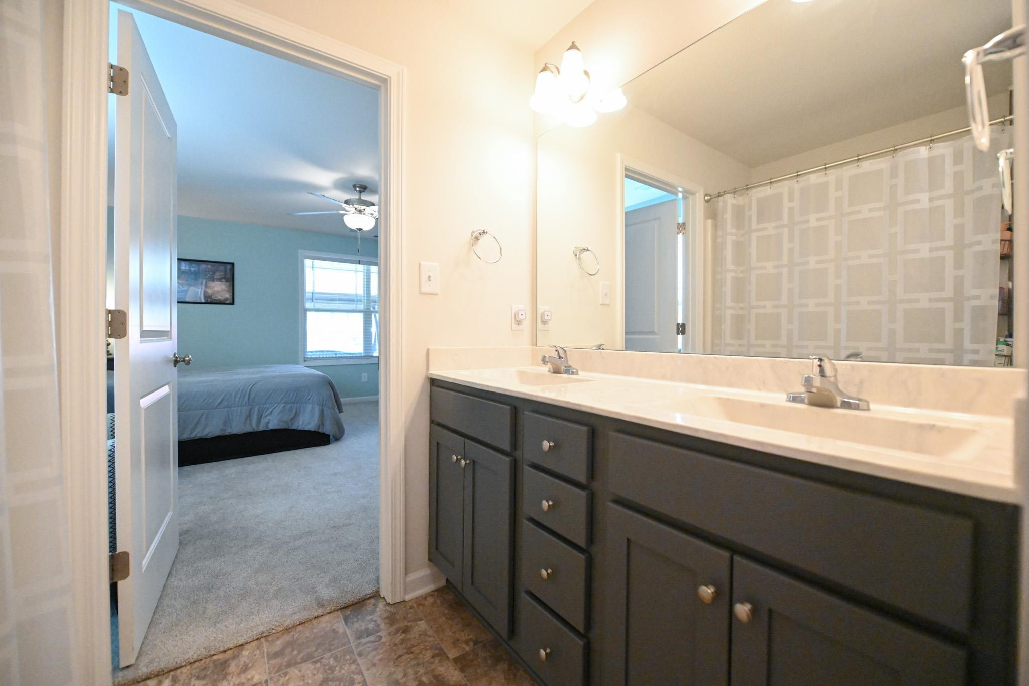 132 Winter Red Way Benson, NC 27504 - Photo 19 of 33 a en suite bathroom with double sink and a mirror