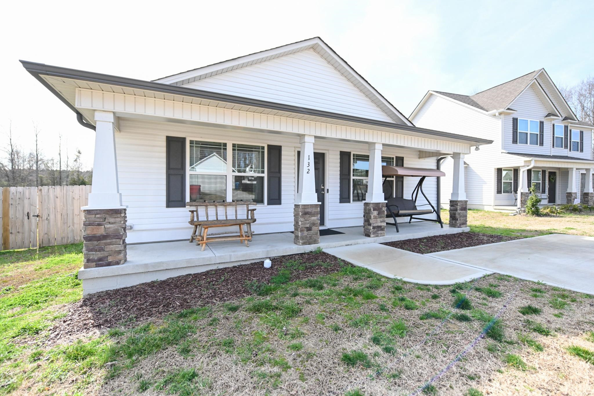 132 Winter Red Way Benson, NC 27504 - Photo 2 of 33 a view of a house with backyard porch and sitting area