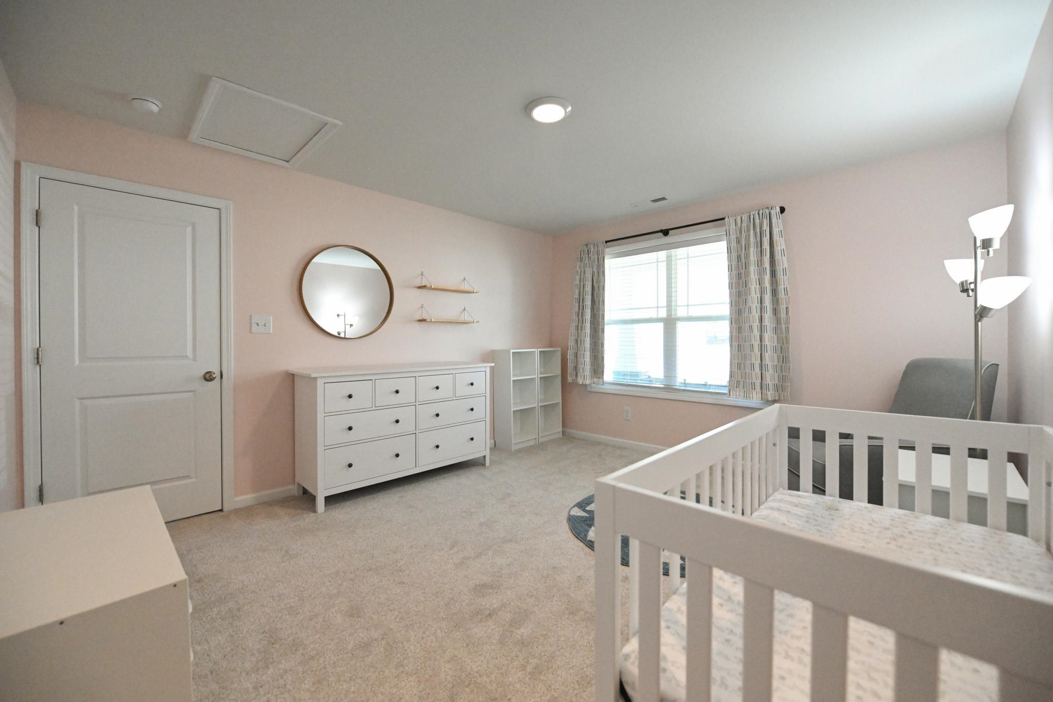 132 Winter Red Way Benson, NC 27504 - Photo 21 of 33 a bedroom with furniture and a window