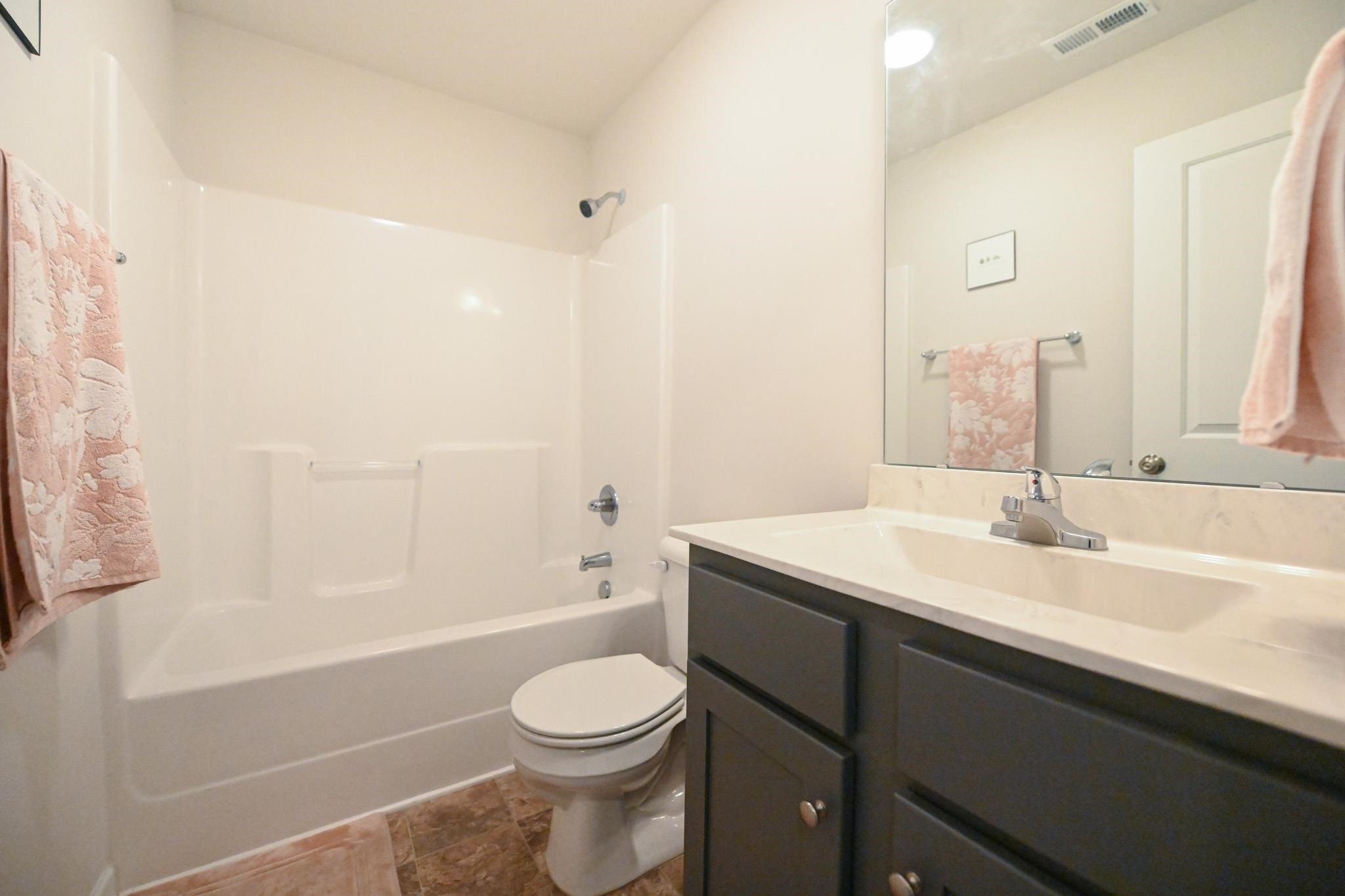 132 Winter Red Way Benson, NC 27504 - Photo 23 of 33 a bathroom with a sink a toilet and shower