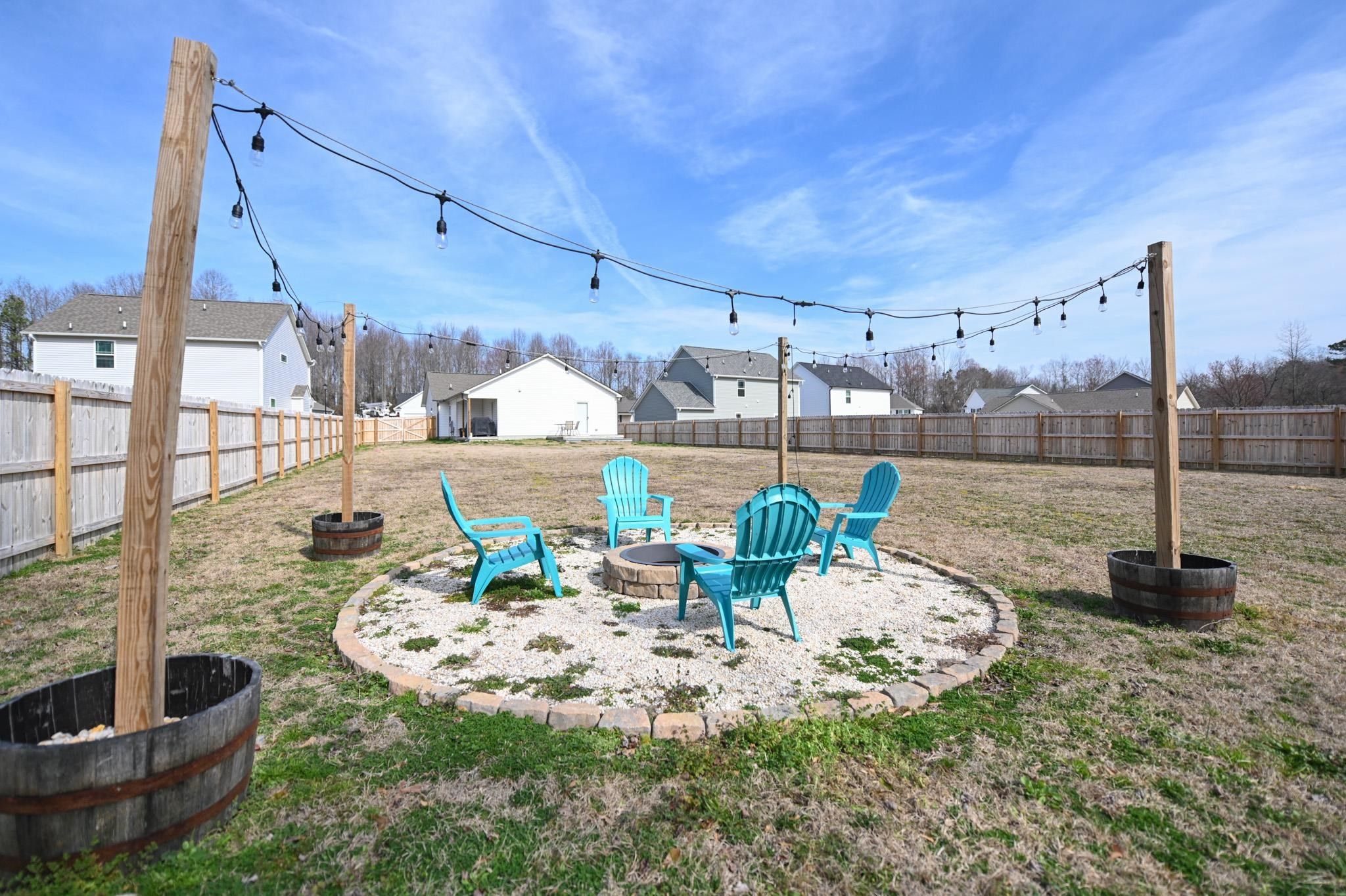 132 Winter Red Way Benson, NC 27504 - Photo 32 of 33 a view of a patio with a table chairs and a potted plants