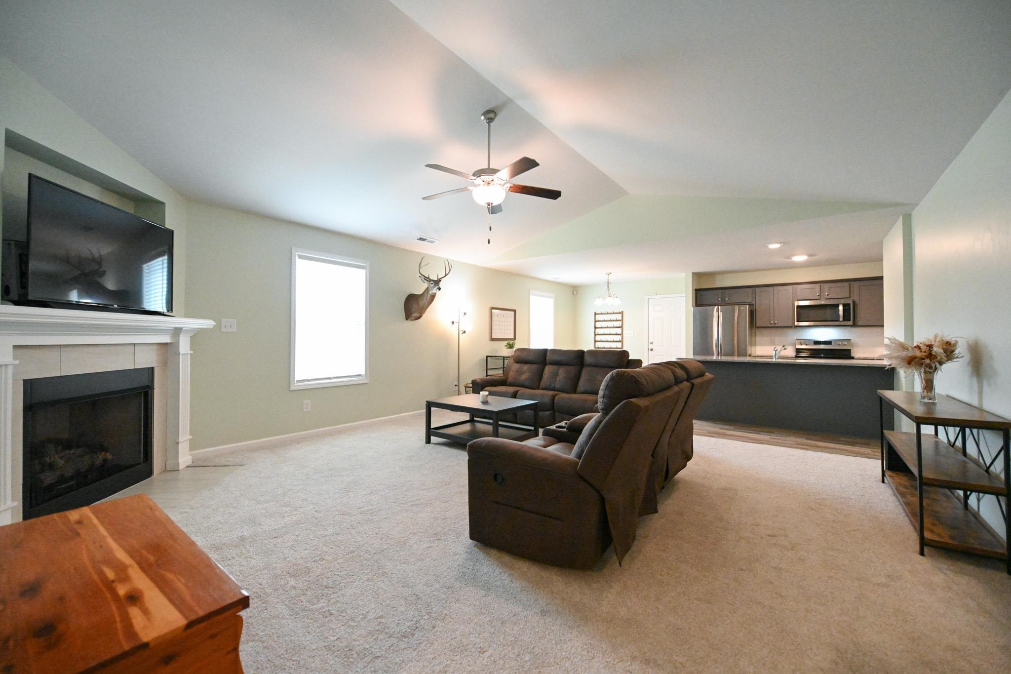 132 Winter Red Way Benson, NC 27504 - Photo 5 of 33 a living room with furniture fireplace and flat screen tv