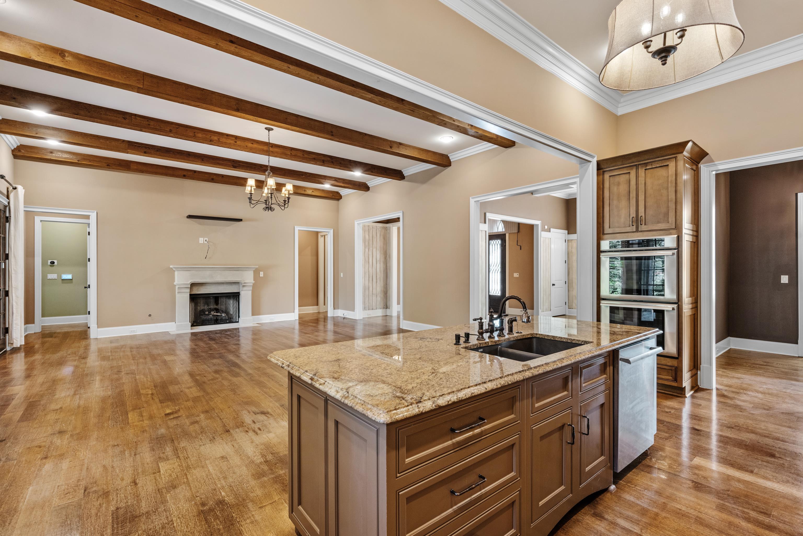 2840 Rue Jordan Cove Germantown, TN 38138 - Photo 13 of 40 a kitchen with stainless steel appliances granite countertop a sink and a refrigerator