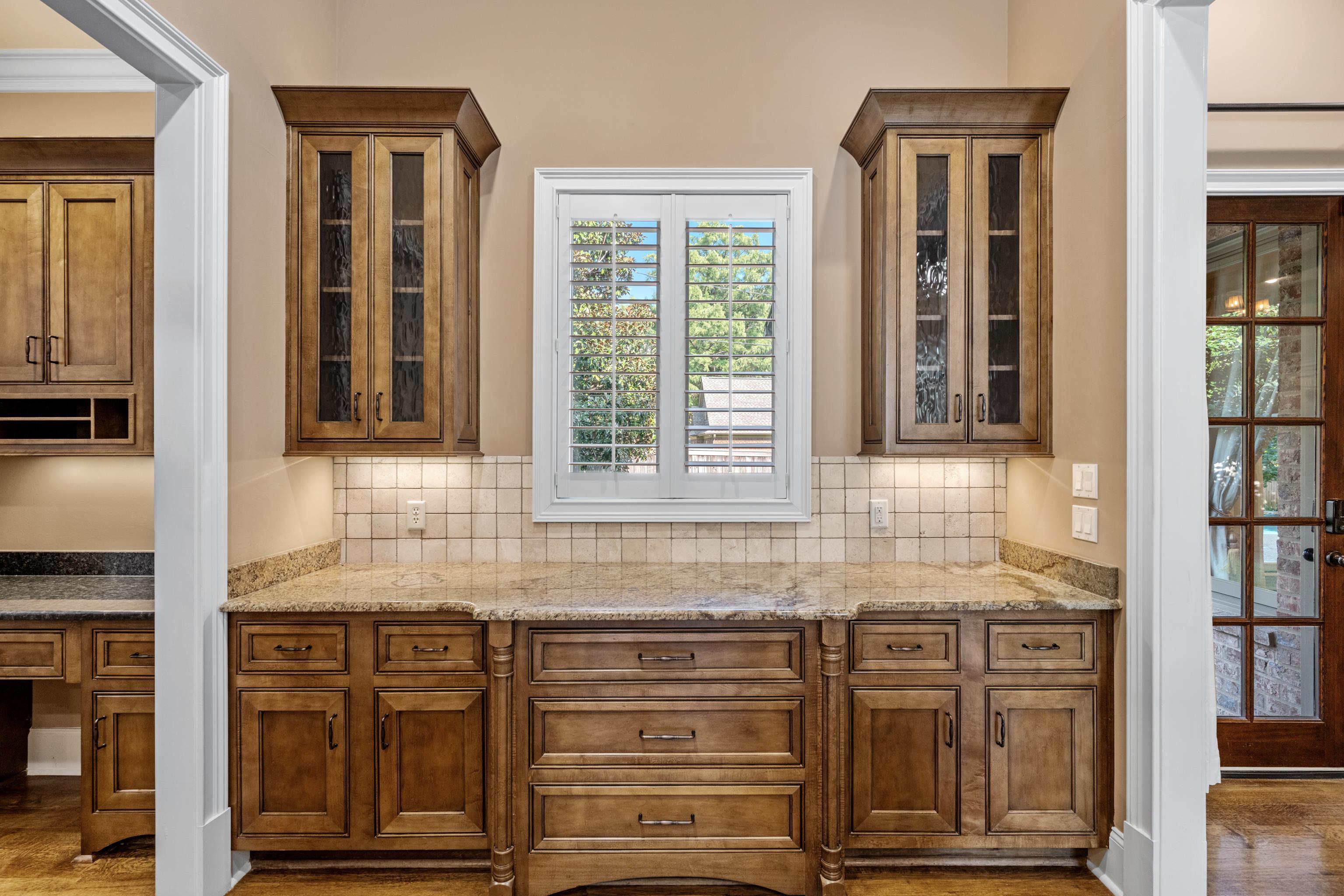 2840 Rue Jordan Cove Germantown, TN 38138 - Photo 14 of 40 a kitchen with granite countertop a sink and cabinets