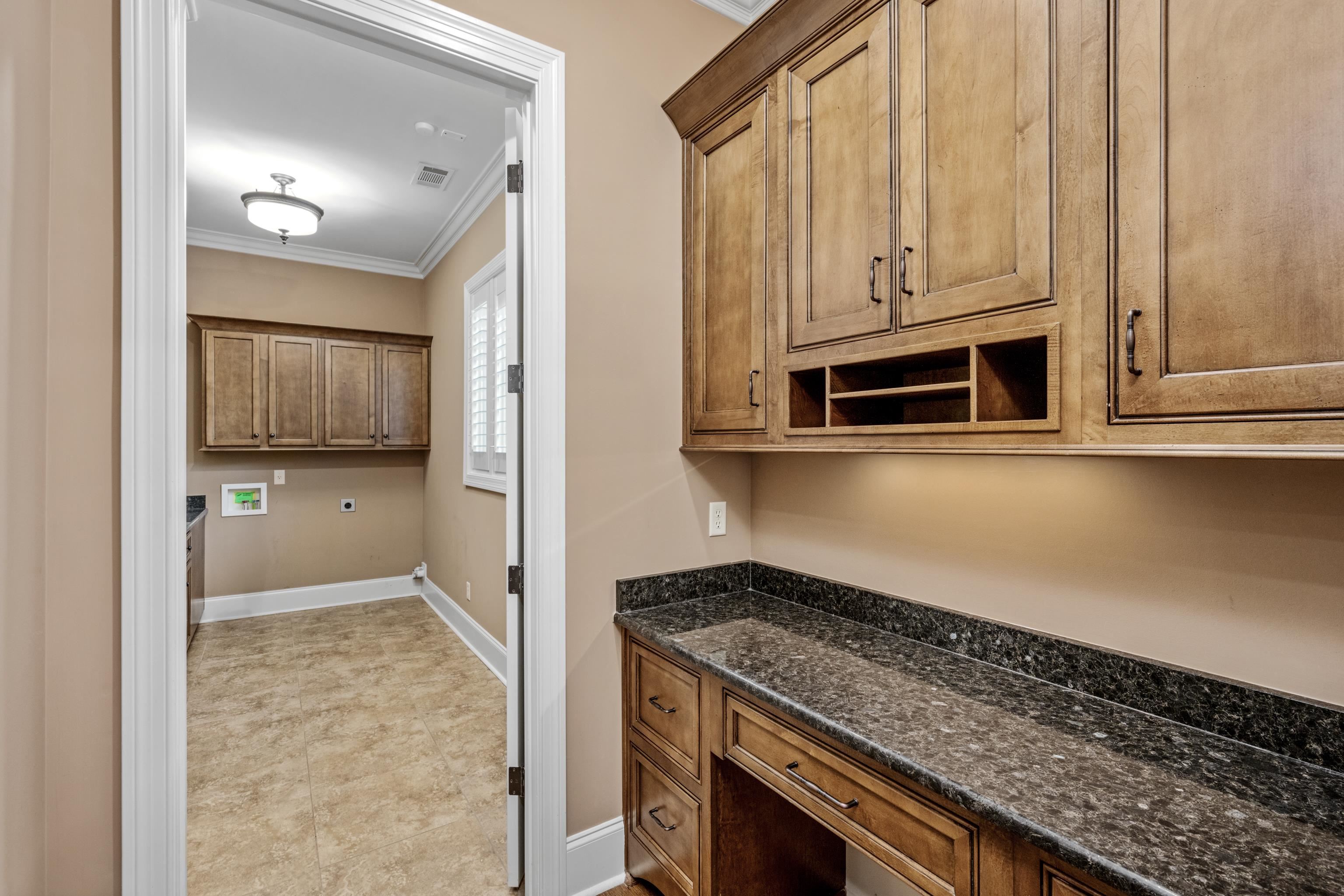2840 Rue Jordan Cove Germantown, TN 38138 - Photo 19 of 40 a kitchen with stainless steel appliances granite countertop a stove and a microwave