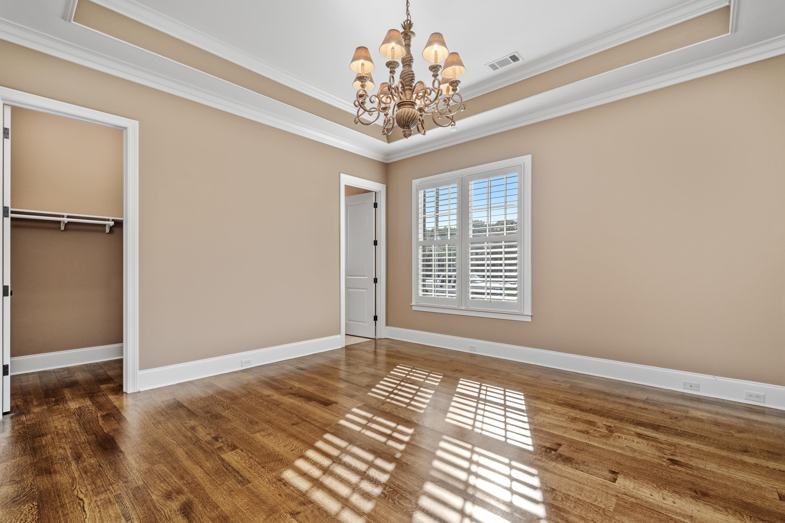 2840 Rue Jordan Cove Germantown, TN 38138 - Photo 26 of 40 a view of an empty room with window and chandelier fan