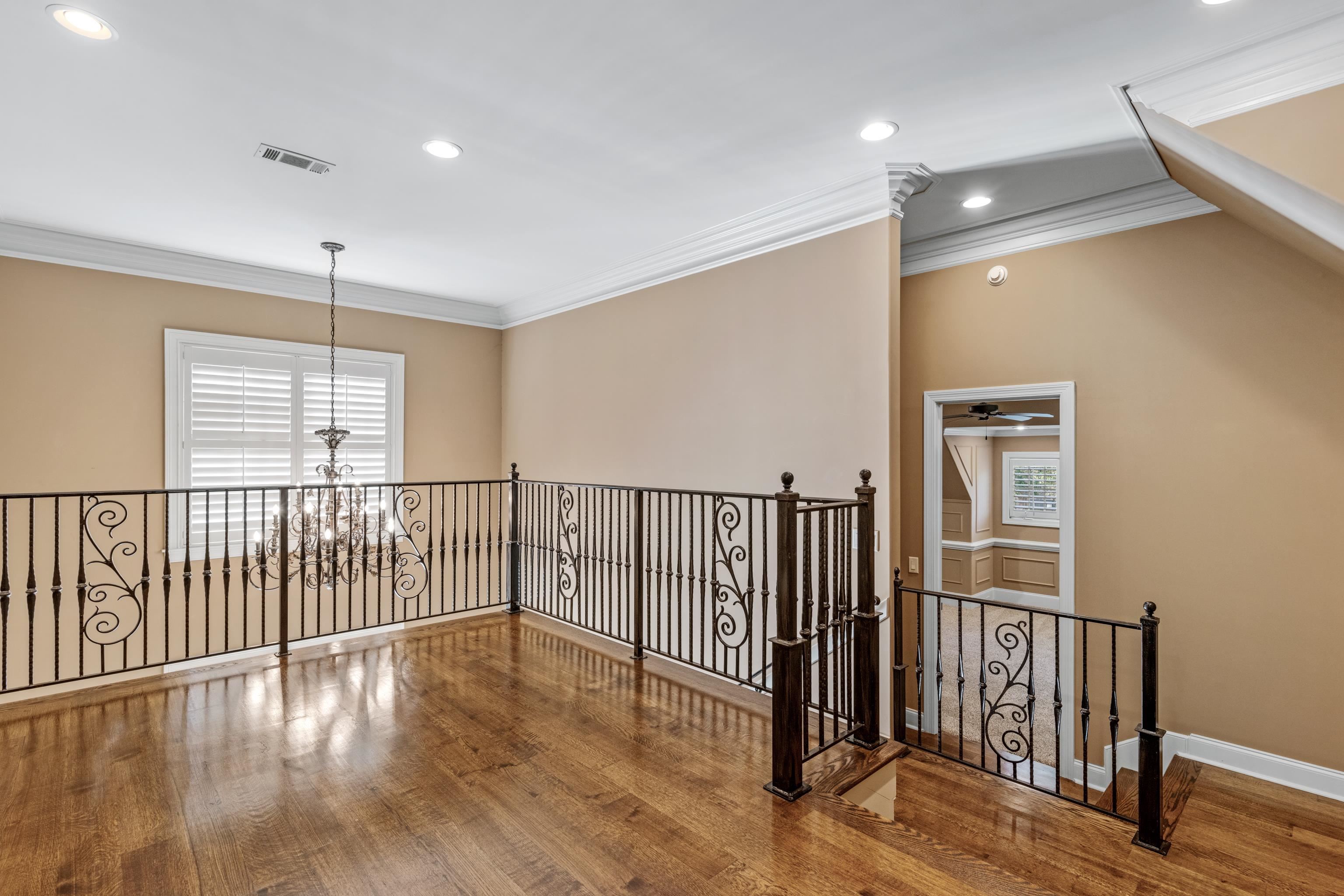 2840 Rue Jordan Cove Germantown, TN 38138 - Photo 28 of 40 a view of a hallway with wooden floor and windows