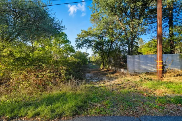 a backyard of a house with lots of green space