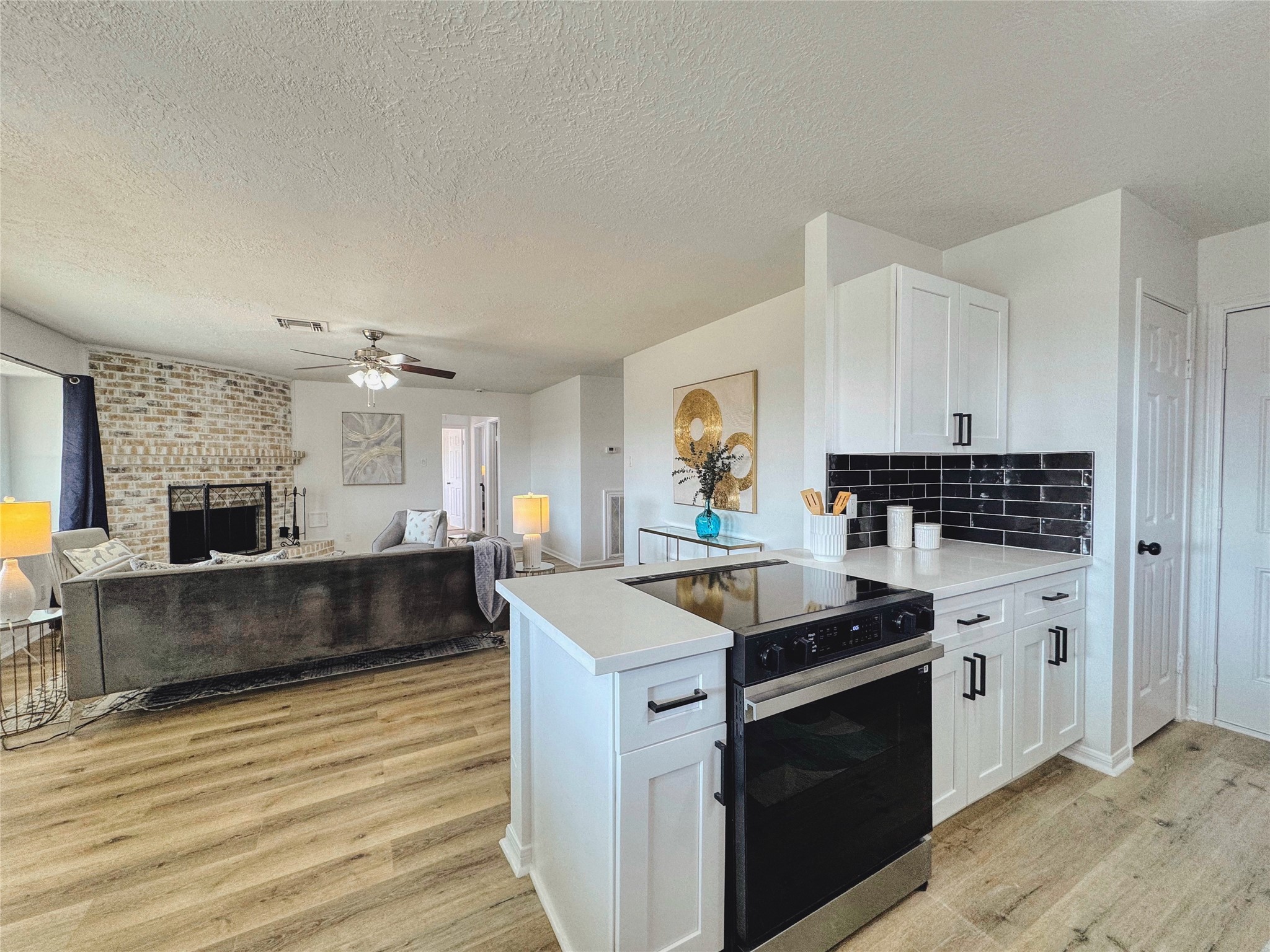 3739 Moonlite Drive Pasadena, TX 77505 - Photo 12 of 32 a kitchen with granite countertop a stove and a sink