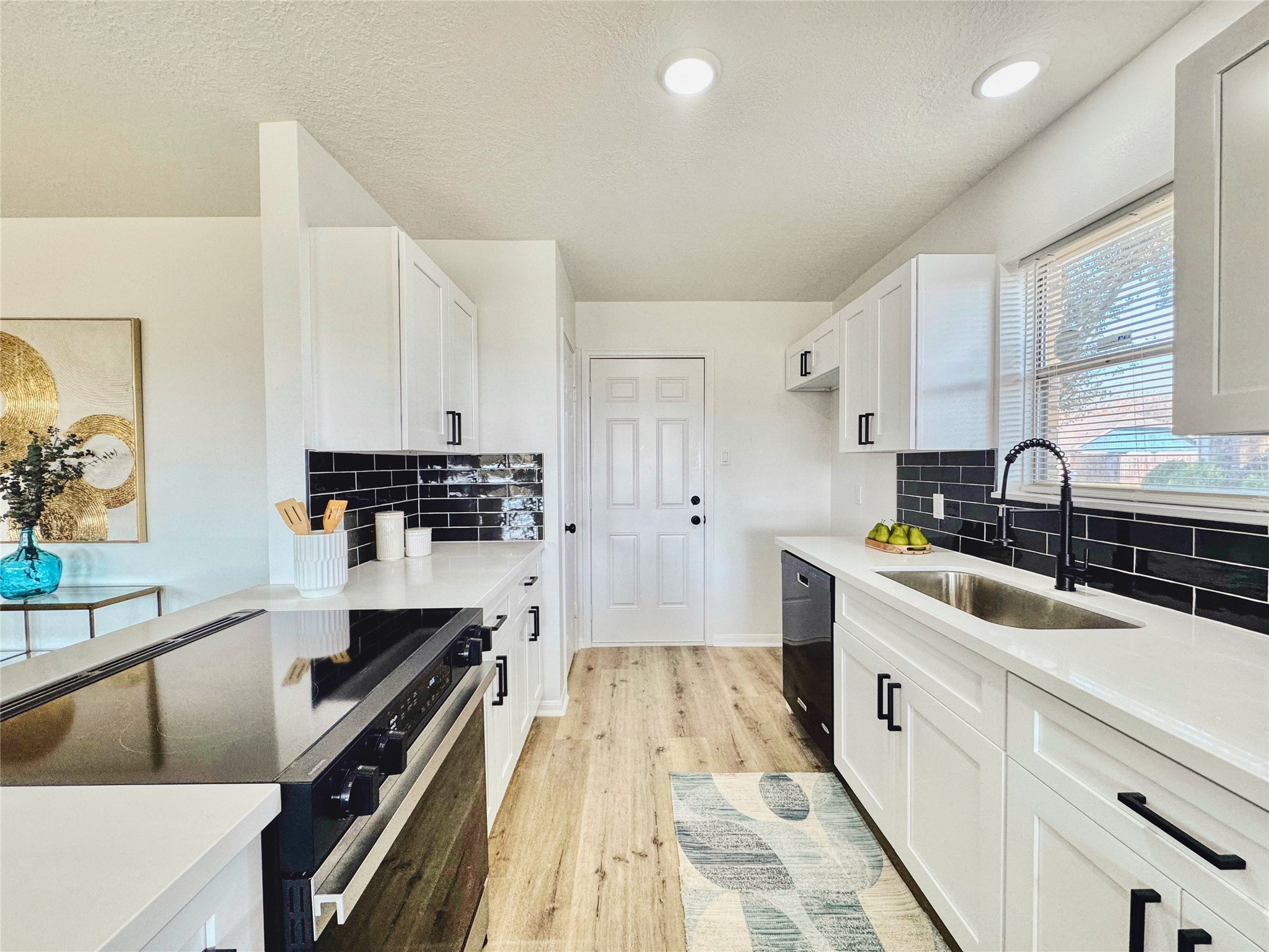 3739 Moonlite Drive Pasadena, TX 77505 - Photo 13 of 32 a kitchen with a sink stove and cabinets