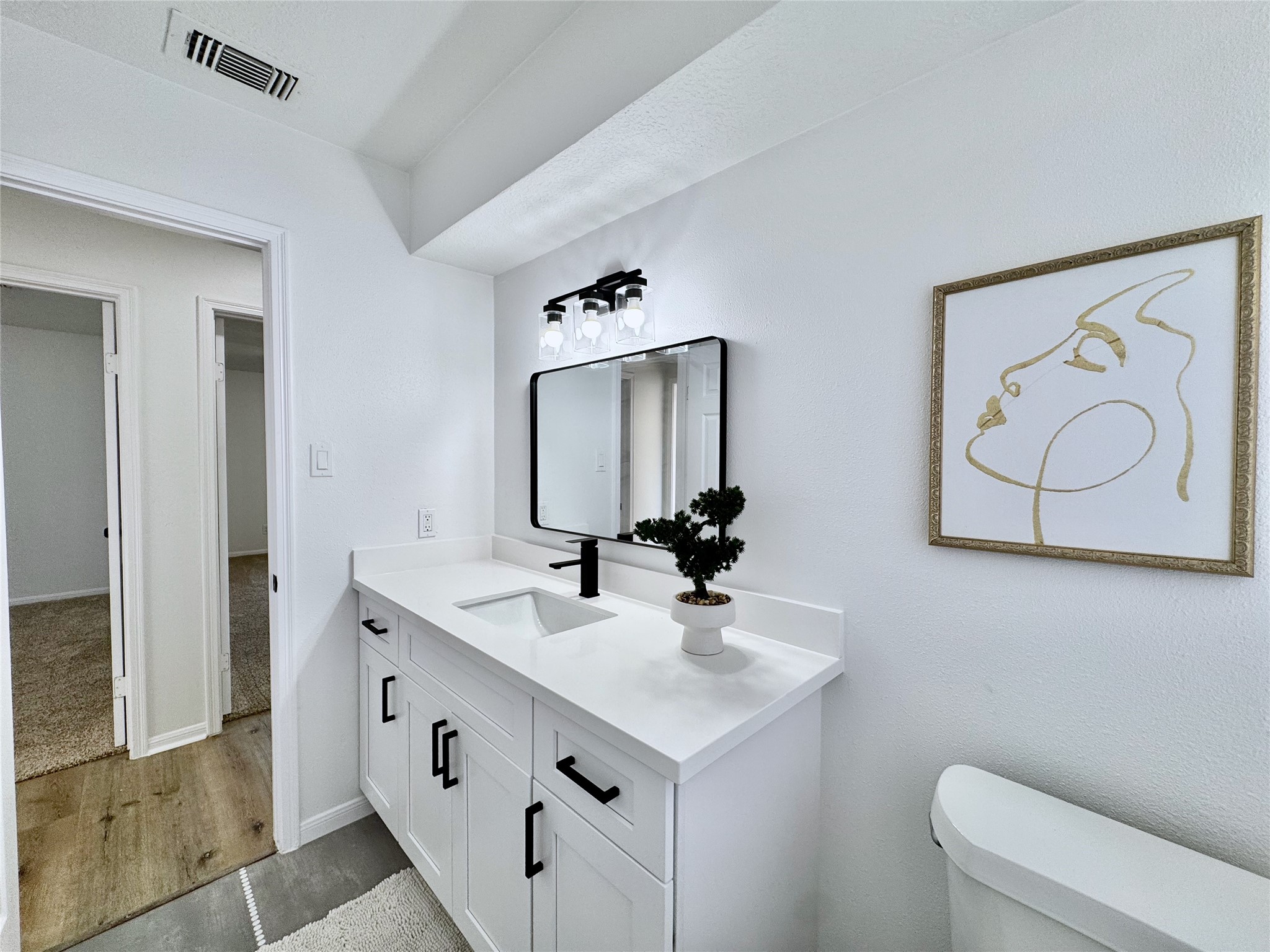 3739 Moonlite Drive Pasadena, TX 77505 - Photo 26 of 32 a bathroom with a sink and a mirror