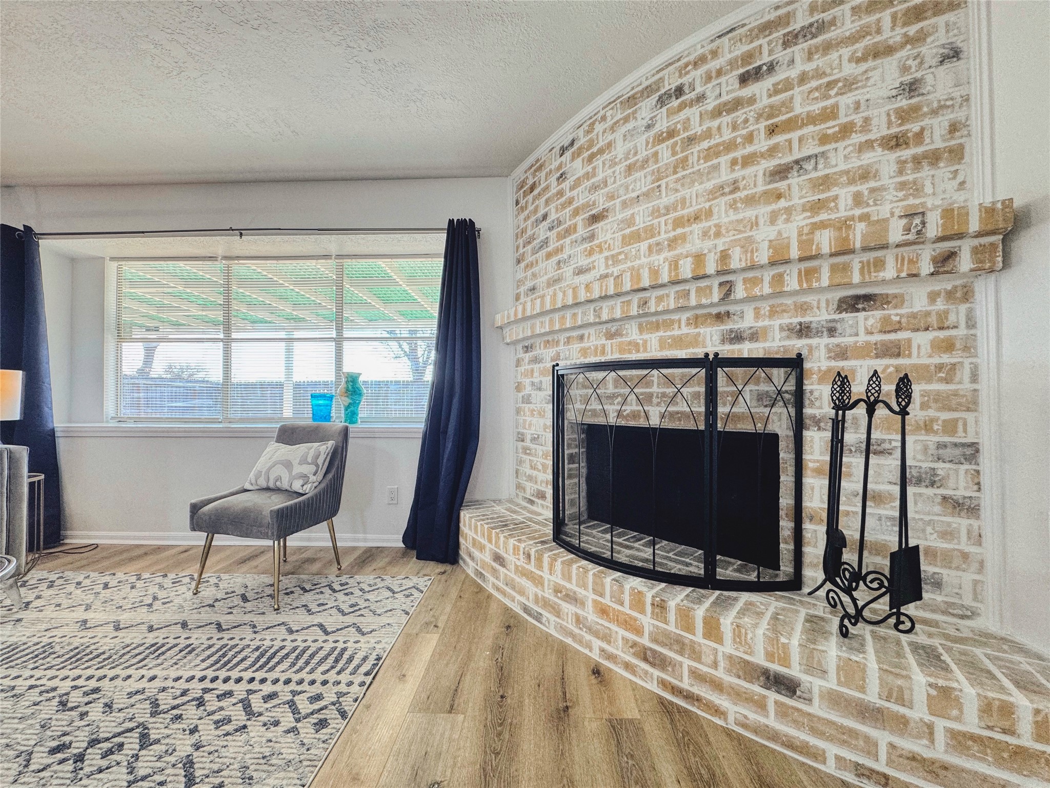 3739 Moonlite Drive Pasadena, TX 77505 - Photo 6 of 32 a living room with a couch a rug and a flat screen tv