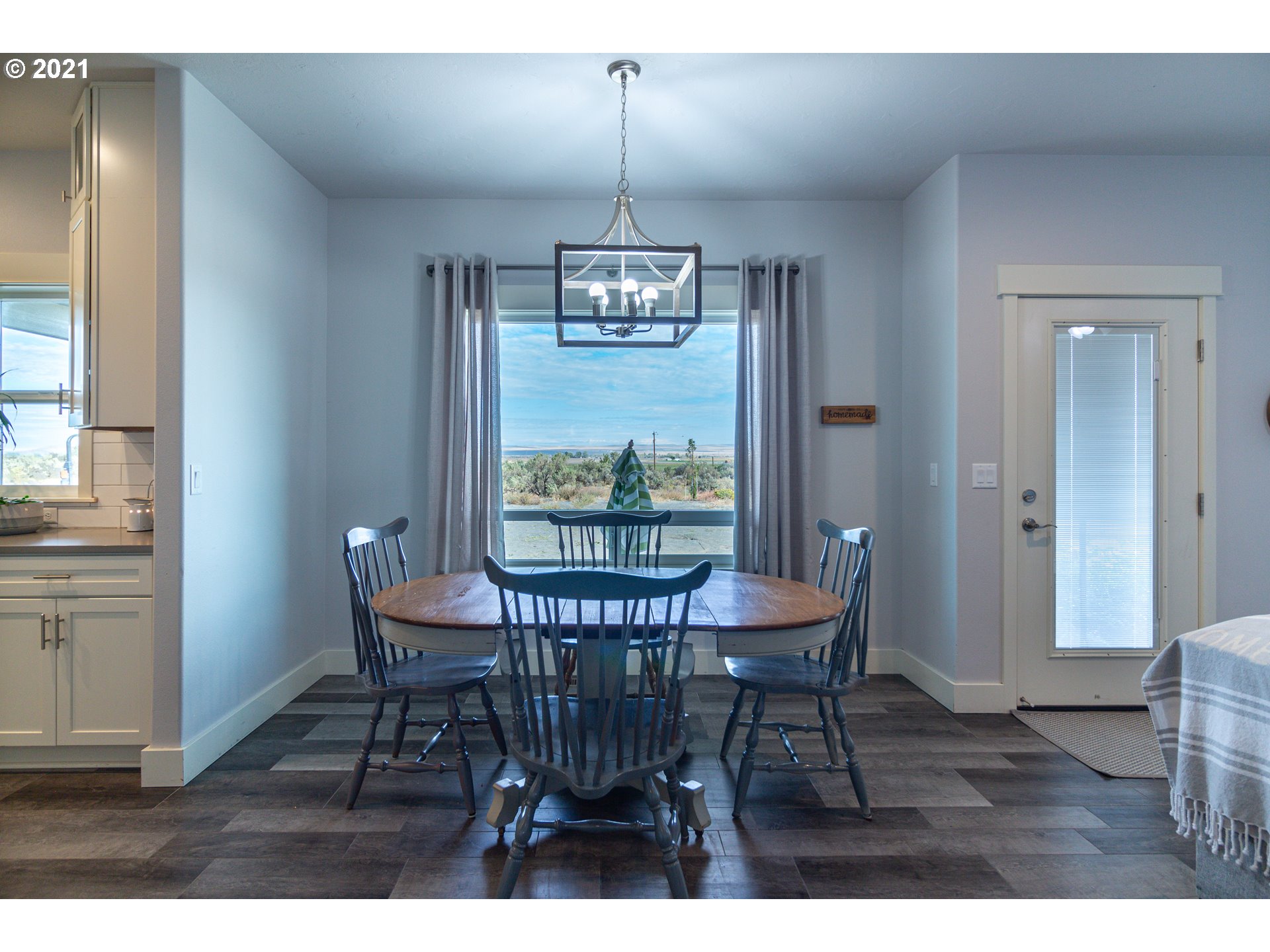31931 Sun Ridge Lane Hermiston, OR 97838 - Photo 3 of 32 a view of a dining room with furniture window and outside view
