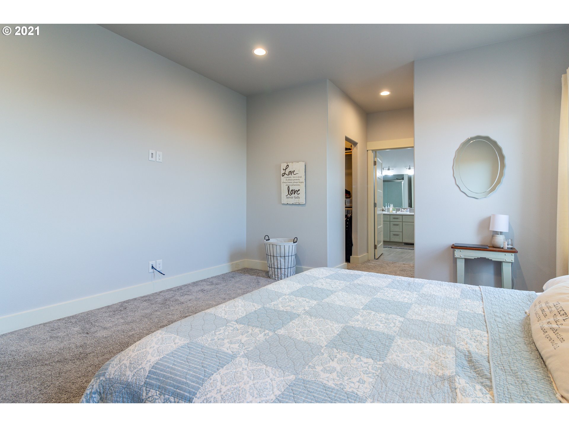 31931 Sun Ridge Lane Hermiston, OR 97838 - Photo 8 of 32 a bedroom with a bed and a mirror
