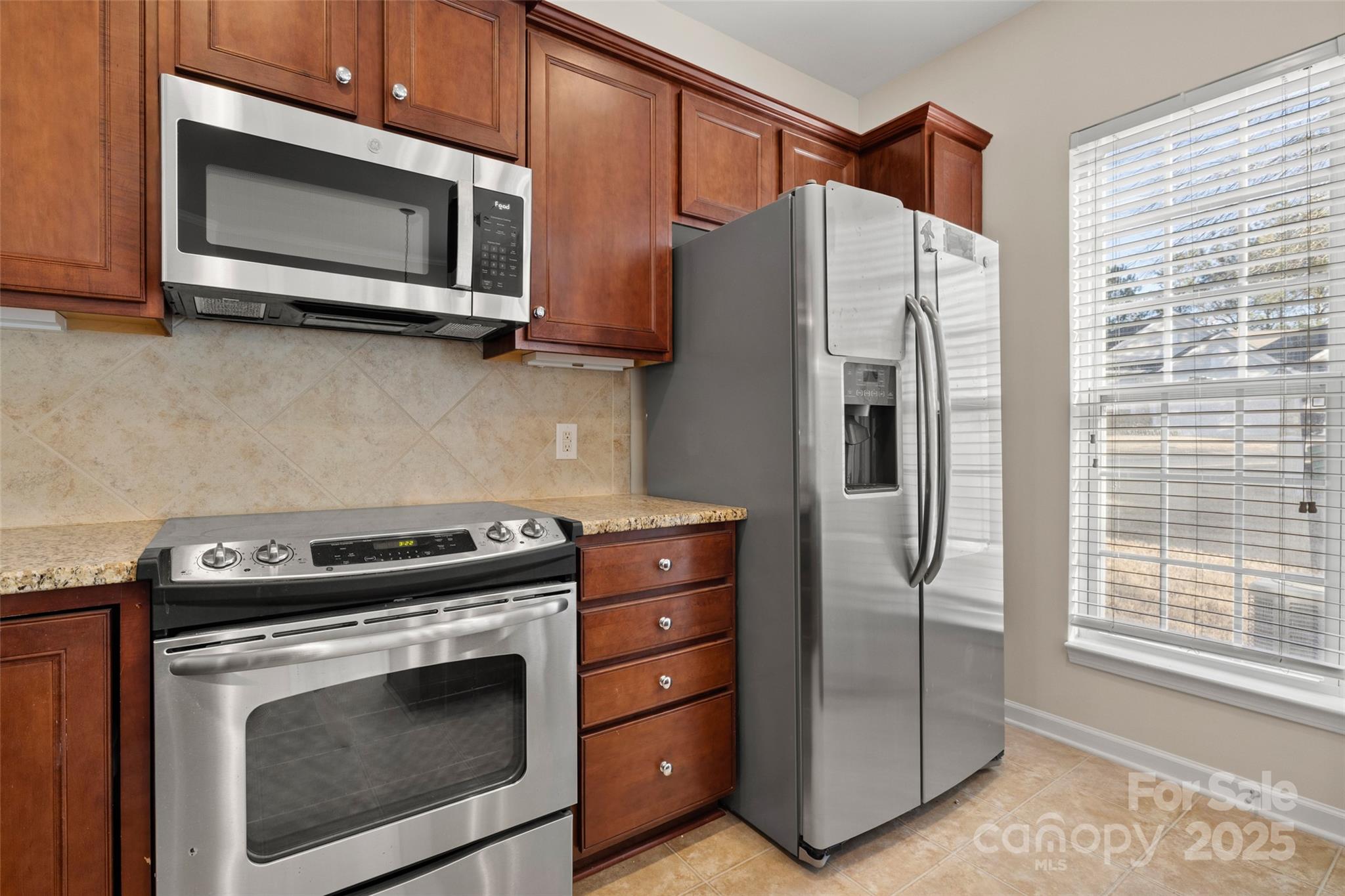 3012 Edisto Way Indian Land, SC 29707 - Photo 12 of 44 a kitchen with stainless steel appliances white cabinets and a stove top oven