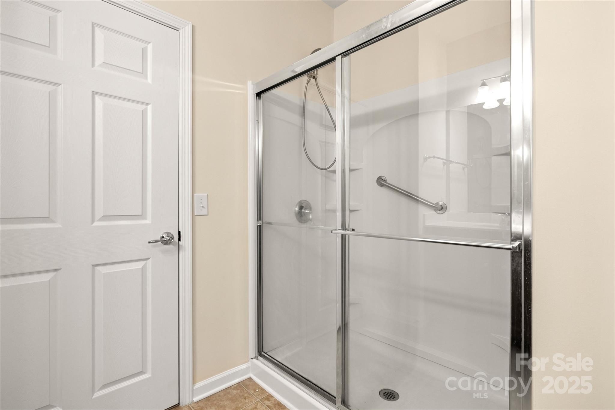 3012 Edisto Way Indian Land, SC 29707 - Photo 16 of 44 a bathroom with a glass shower door