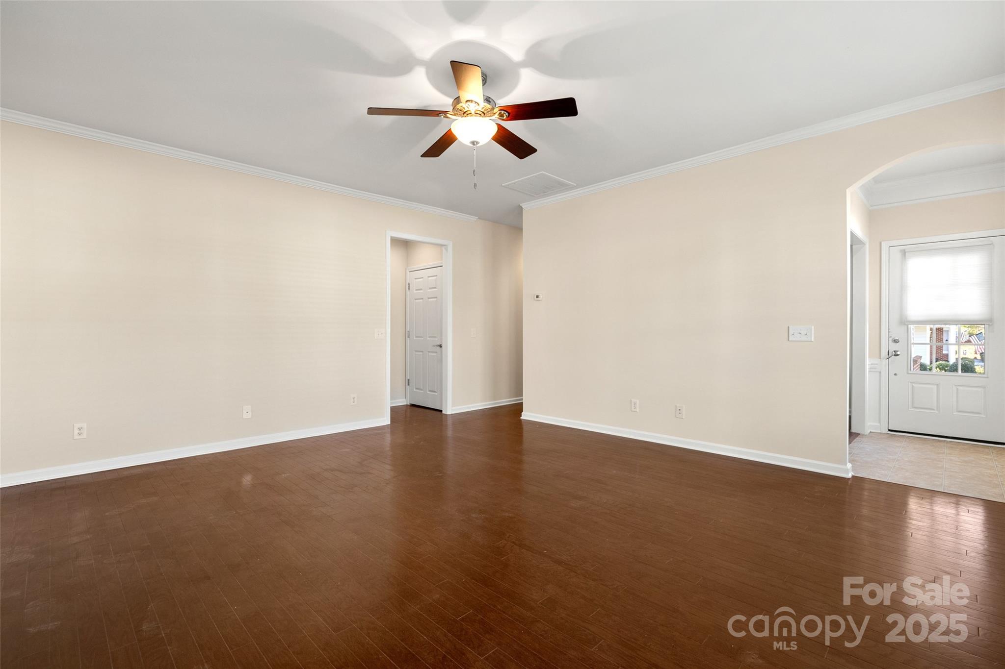 3012 Edisto Way Indian Land, SC 29707 - Photo 7 of 44 an empty room with wooden floor fan and windows