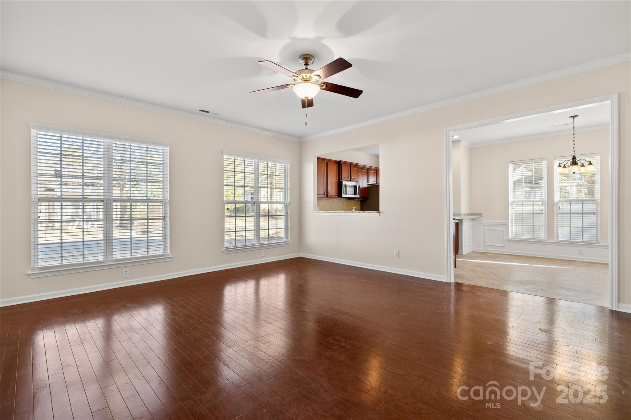 3012 Edisto Way Indian Land, SC 29707 - Photo 8 of 44 a view of an empty room with wooden floor and a window