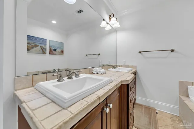 a bedroom with a bed and a flat tv screen