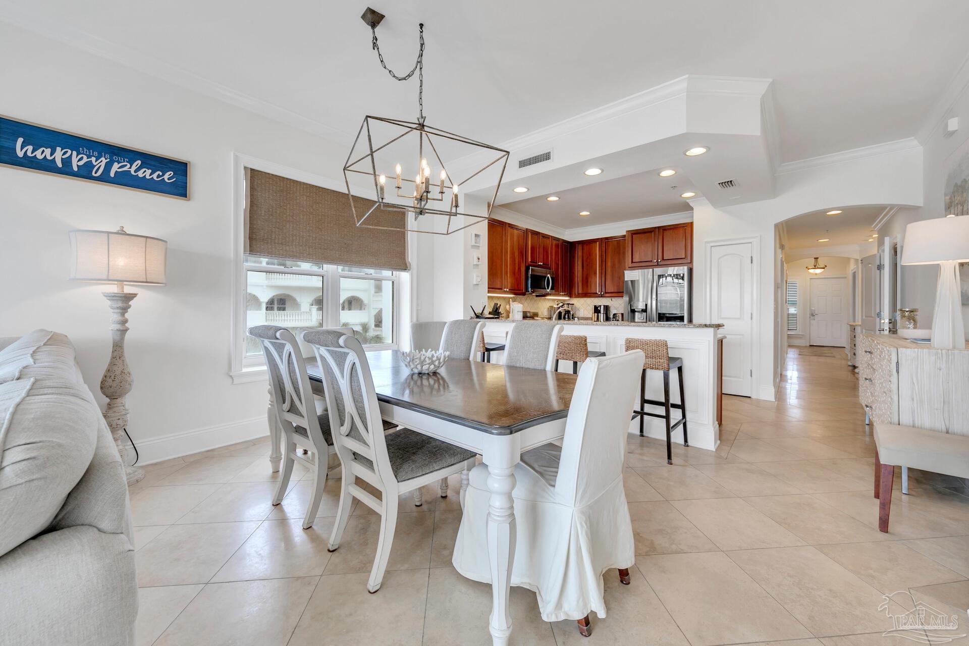 2421 West County Highway 30A, Unit G405 Santa Rosa Beach, FL 32459 - Photo 15 of 35 a view of a dining room with furniture