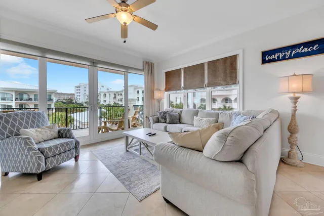 a living room with furniture large window and a fireplace