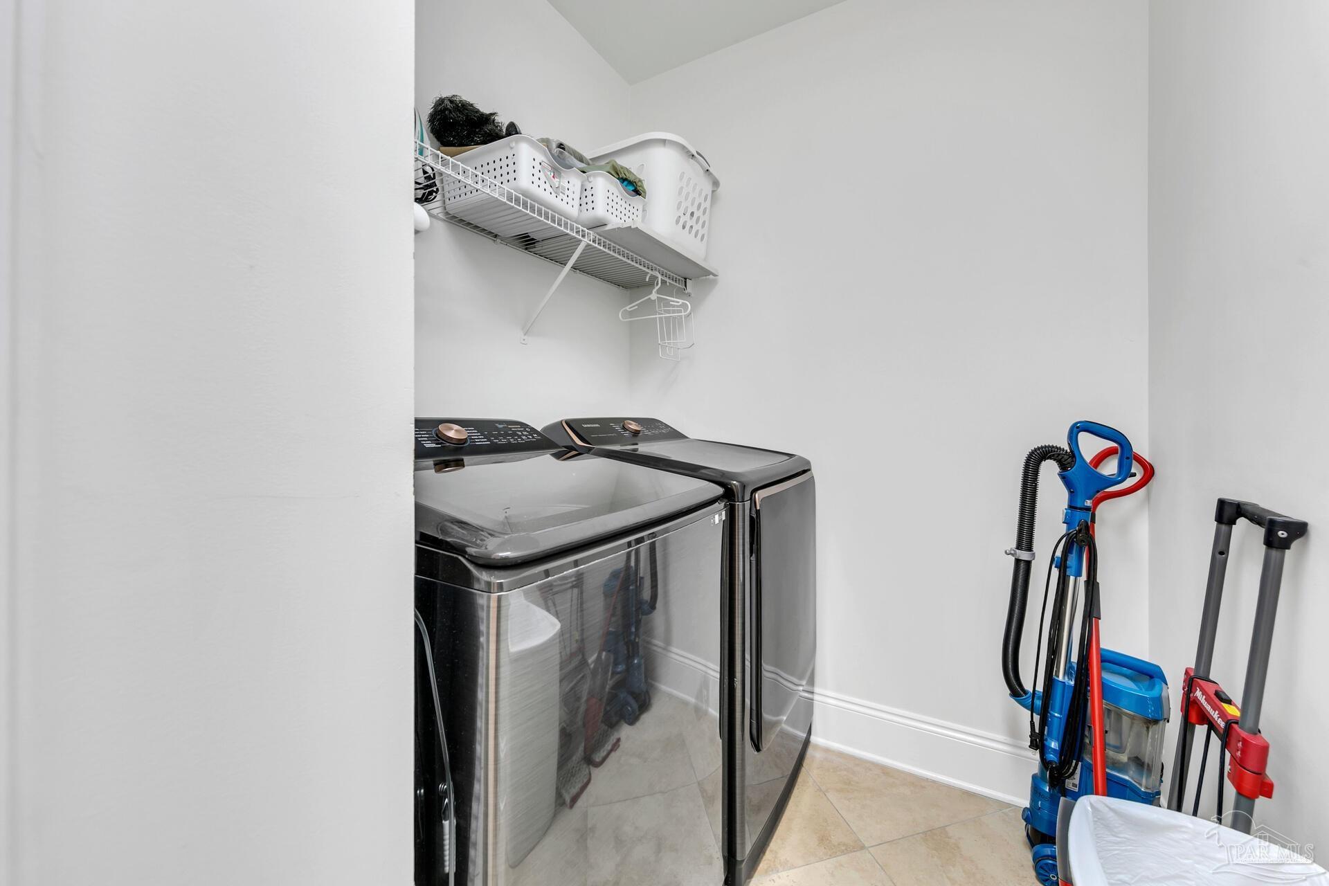 2421 West County Highway 30A, Unit G405 Santa Rosa Beach, FL 32459 - Photo 25 of 35 a view of walk in closet with clothes and shoes