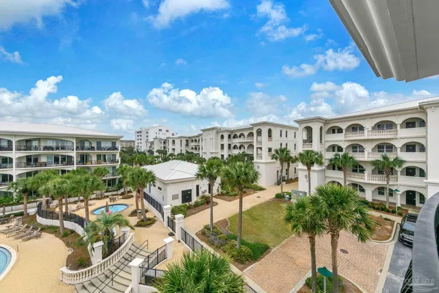 a view of a chairs and table in patio