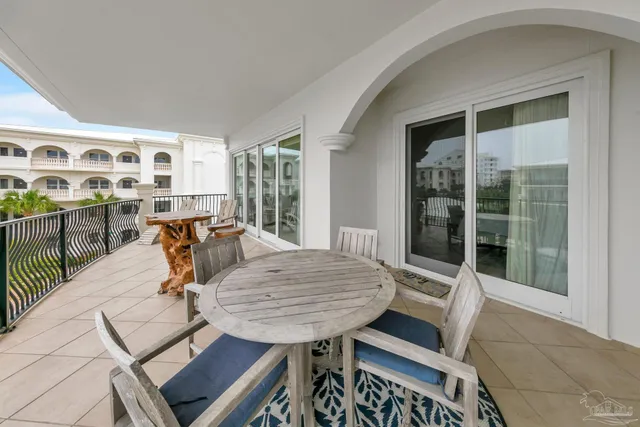a view of a patio with table and chairs
