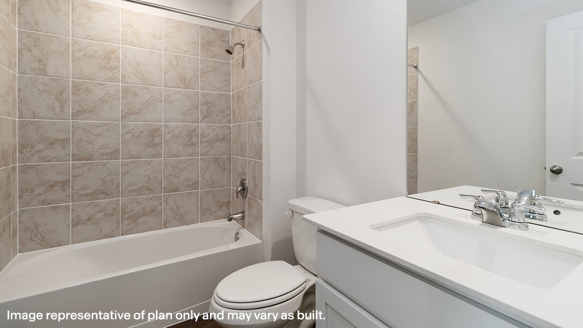136 Wyatt Way Jarrell, TX 76537 - Photo 23 of 26 a bathroom with a sink a toilet and a bathtub